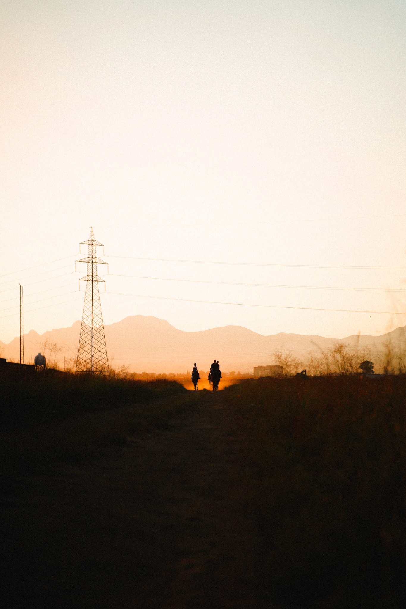 Riders crossing the Northern Cyprus landscape at sunset